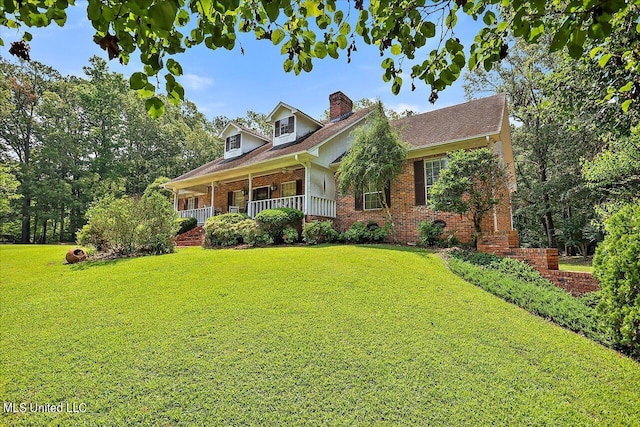1600 Pine Hill Dr, Raymond, MS 39154 - cape cod home with brick siding, a front lawn, covered porch, and a chimney