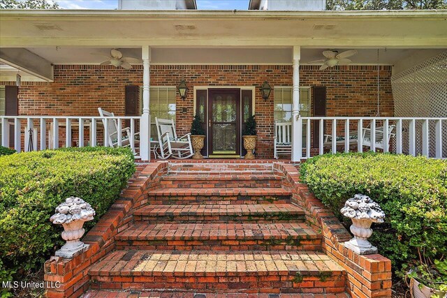 1600 Pine Hill Dr, Raymond, MS 39154 - doorway to property with ceiling fan, a porch, and brick siding
