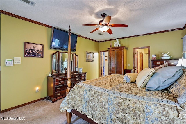 carpeted bedroom with ceiling fan, crown molding, and a textured ceiling