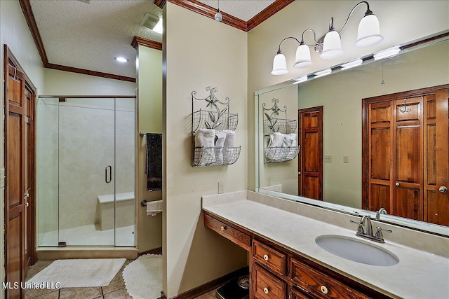 1600 Pine Hill Dr, Raymond, MS 39154 - bathroom featuring crown molding, a stall shower, tile patterned floors, vanity, and a textured ceiling
