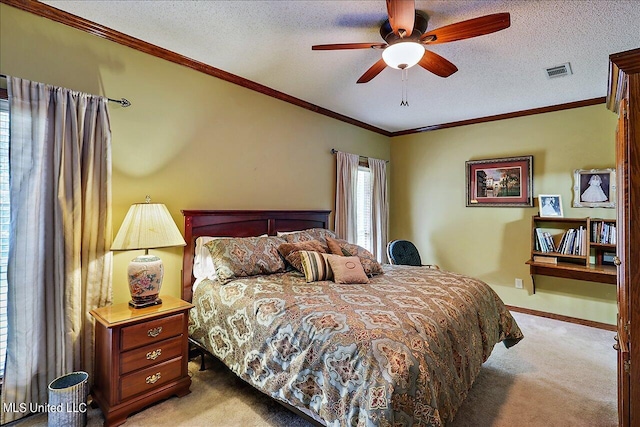 bedroom featuring ceiling fan, light carpet, a textured ceiling, and ornamental molding