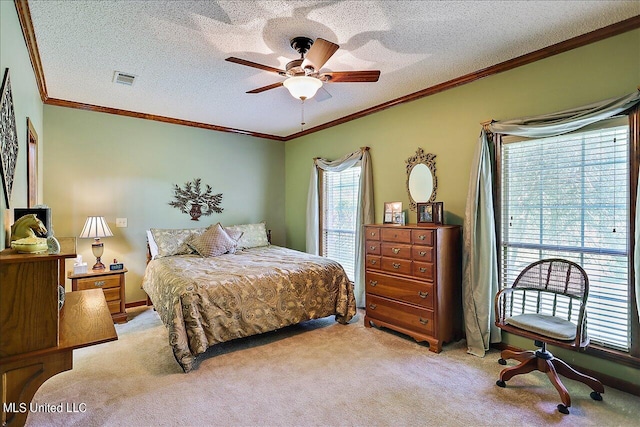 carpeted bedroom with crown molding, a textured ceiling, and ceiling fan