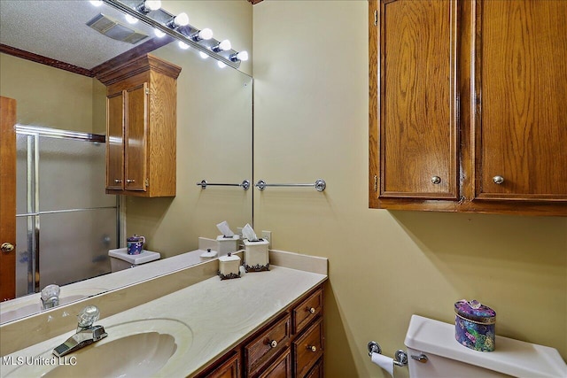 1600 Pine Hill Dr, Raymond, MS 39154 - bathroom with vanity, an enclosed shower, crown molding, and toilet