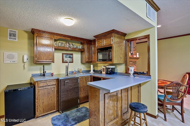 kitchen with light carpet, kitchen peninsula, a textured ceiling, and black appliances