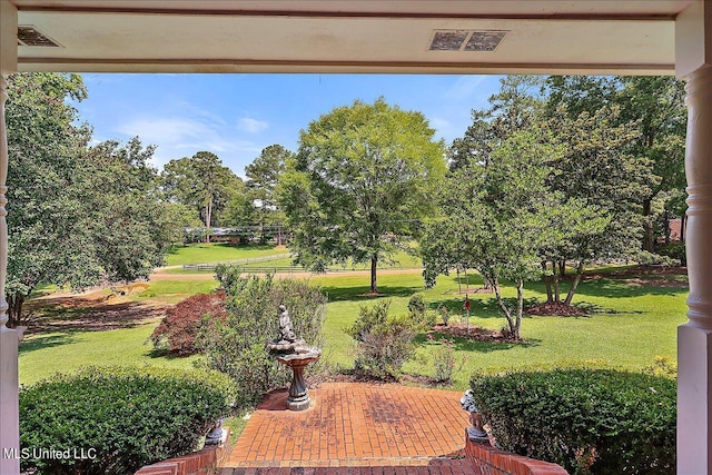 1600 Pine Hill Dr, Raymond, MS 39154 - view of green lawn featuring a patio and view of wooded area
