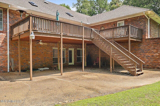 back of property featuring a wooden deck