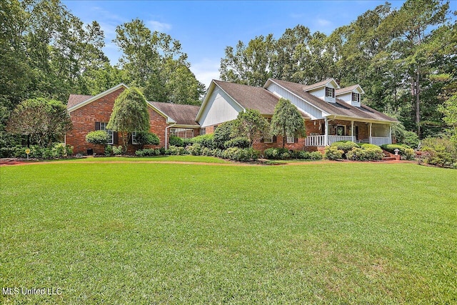 cape cod home with a front yard and covered porch