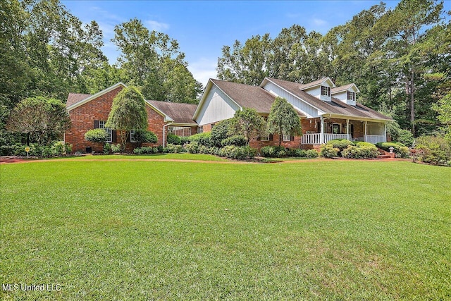 1600 Pine Hill Dr, Raymond, MS 39154 - view of front of home with brick siding, a front yard, and covered porch