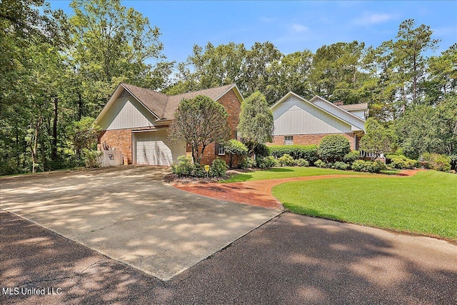 view of front facade with a garage and a front lawn