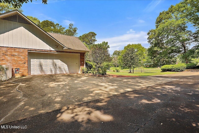 view of home's exterior with a garage