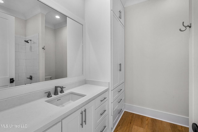 54 Windermere Blvd, Madison, MS 39110 - bathroom featuring toilet, wood finished floors, vanity, baseboards, and recessed lighting
