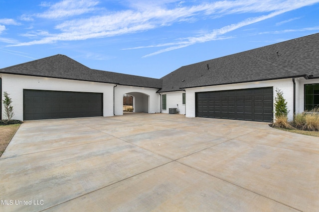 54 Windermere Blvd, Madison, MS 39110 - view of front of property featuring driveway, a garage, cooling unit, and roof with shingles