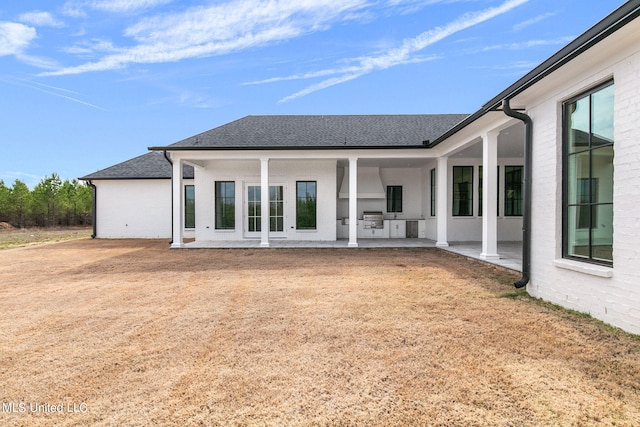 54 Windermere Blvd, Madison, MS 39110 - rear view of property featuring a patio, roof with shingles, and brick siding