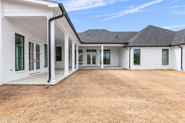 54 Windermere Blvd, Madison, MS 39110 - back of property featuring french doors, a shingled roof, a patio area, and brick siding