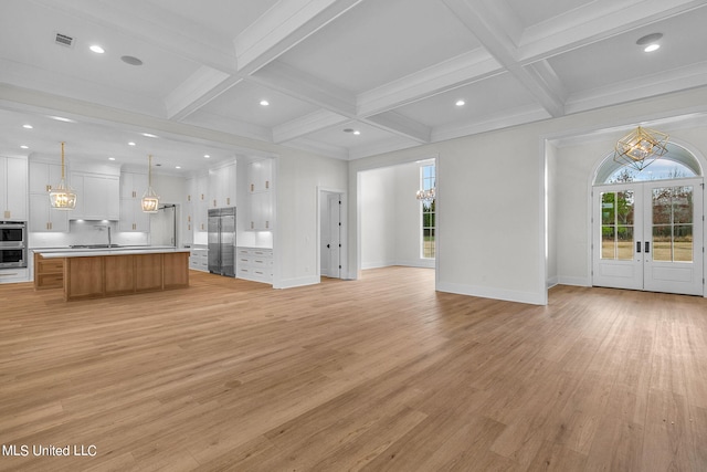 54 Windermere Blvd, Madison, MS 39110 - unfurnished living room featuring a chandelier, light wood finished floors, plenty of natural light, beam ceiling, and coffered ceiling