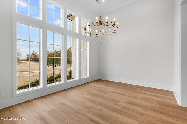 54 Windermere Blvd, Madison, MS 39110 - spare room featuring plenty of natural light, baseboards, a chandelier, and a towering ceiling