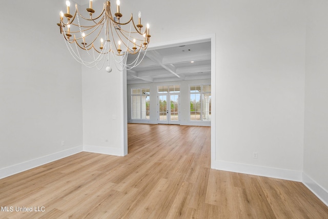 54 Windermere Blvd, Madison, MS 39110 - empty room with coffered ceiling, baseboards, light wood finished floors, a chandelier, and beam ceiling