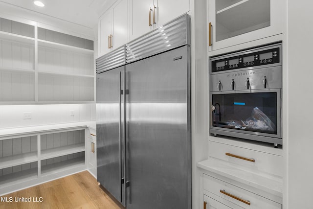 54 Windermere Blvd, Madison, MS 39110 - kitchen featuring built in refrigerator, white cabinets, open shelves, light countertops, and light wood-type flooring