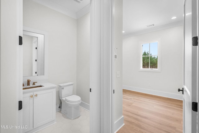 54 Windermere Blvd, Madison, MS 39110 - half bath with toilet, ornamental molding, vanity, baseboards, and wood finished floors