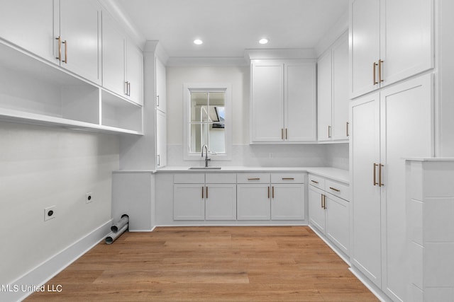 54 Windermere Blvd, Madison, MS 39110 - laundry area with hookup for an electric dryer, a sink, recessed lighting, light wood finished floors, and baseboards