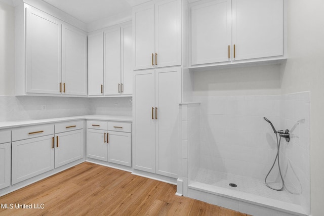 54 Windermere Blvd, Madison, MS 39110 - kitchen with light countertops, light wood-style floors, and white cabinetry