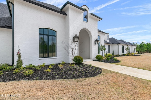 54 Windermere Blvd, Madison, MS 39110 - view of front facade with a front lawn and brick siding