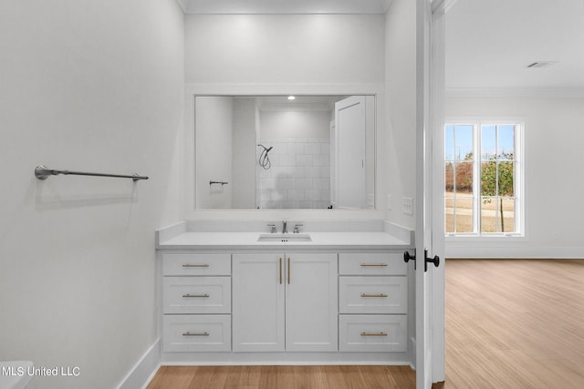 54 Windermere Blvd, Madison, MS 39110 - bathroom with wood finished floors, baseboards, vanity, and tiled shower
