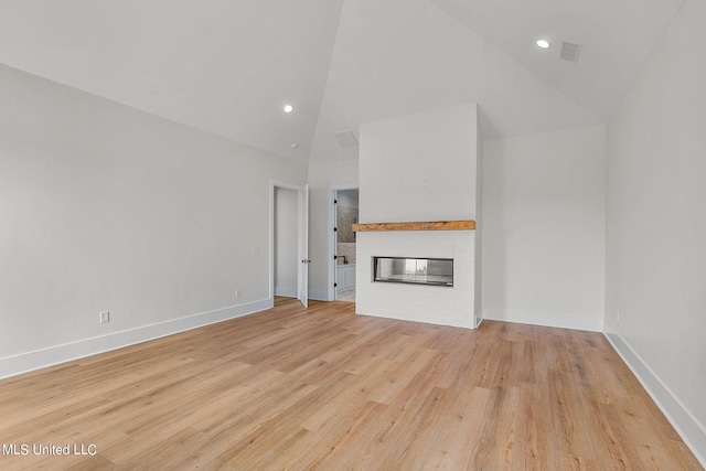 54 Windermere Blvd, Madison, MS 39110 - unfurnished living room with light wood-type flooring, baseboards, a multi sided fireplace, recessed lighting, and high vaulted ceiling