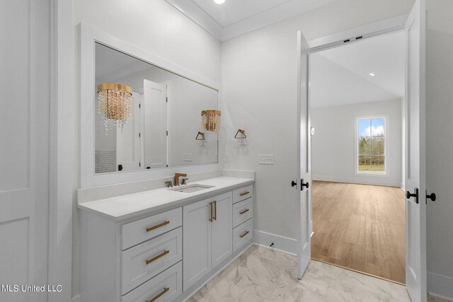 54 Windermere Blvd, Madison, MS 39110 - bathroom featuring baseboards, vanity, and marble look tiles