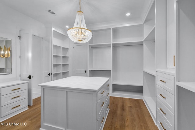 54 Windermere Blvd, Madison, MS 39110 - walk in closet featuring a chandelier and dark wood-style floors