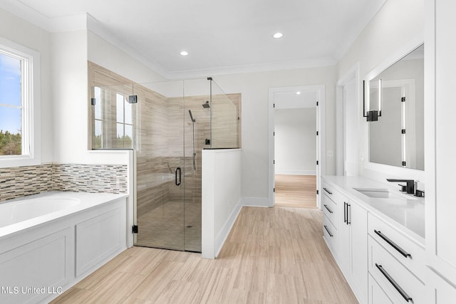 54 Windermere Blvd, Madison, MS 39110 - bathroom featuring healthy amount of natural light, a shower stall, wood finished floors, vanity, and recessed lighting