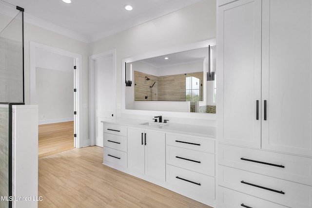 54 Windermere Blvd, Madison, MS 39110 - bathroom with tiled shower, wood finished floors, vanity, recessed lighting, and baseboards