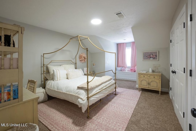 bedroom featuring light colored carpet