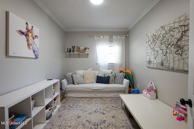 sitting room featuring ornamental molding