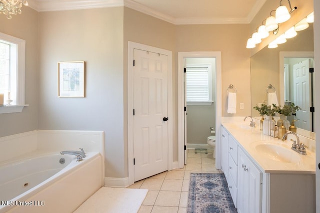 bathroom with toilet, vanity, tile patterned floors, and plenty of natural light