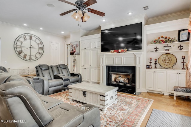 2550 Jones Rd, Terry, MS 39170 - living area with a ceiling fan, crown molding, a tiled fireplace, recessed lighting, and light tile patterned floors