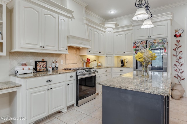 2550 Jones Rd, Terry, MS 39170 - kitchen with gas stove, light tile patterned flooring, fridge, light stone counters, and crown molding