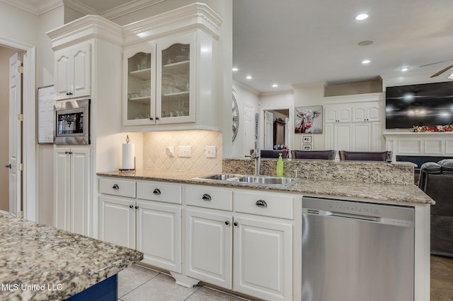 2550 Jones Rd, Terry, MS 39170 - kitchen featuring appliances with stainless steel finishes, ornamental molding, light stone countertops, tasteful backsplash, and glass insert cabinets