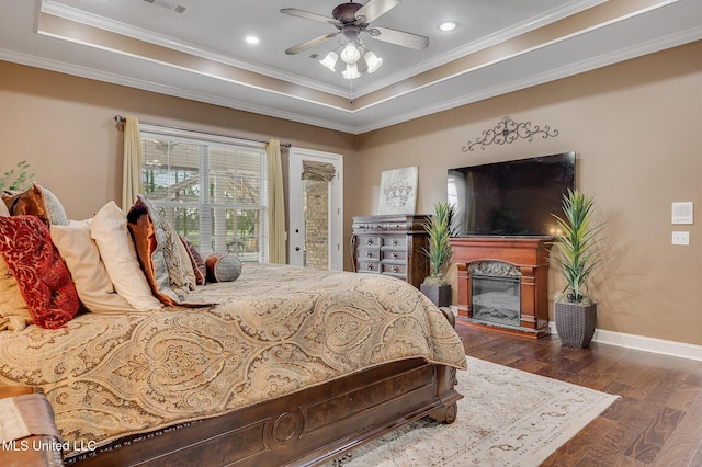 2550 Jones Rd, Terry, MS 39170 - bedroom with access to outside, a raised ceiling, dark wood finished floors, crown molding, and a premium fireplace