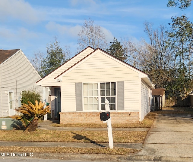 view of front of property with fence and brick siding