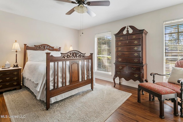 bedroom with dark wood-type flooring and ceiling fan