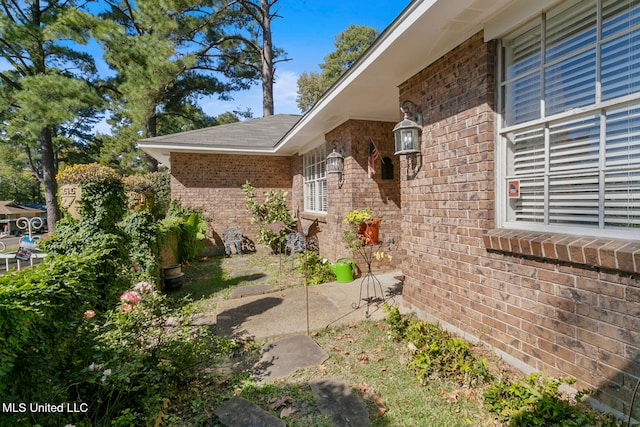 view of side of property with a patio