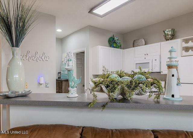 kitchen featuring white cabinetry