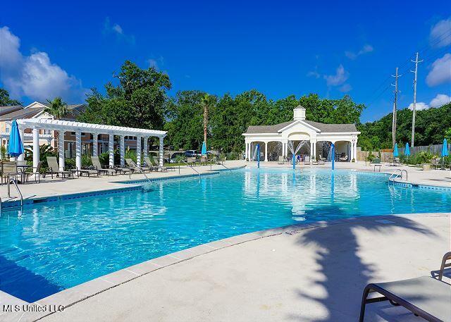 view of swimming pool featuring a patio area and a pergola