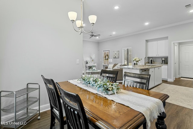 dining room featuring baseboards, dark wood-style flooring, and ornamental molding