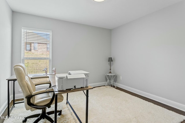 office featuring baseboards and wood finished floors