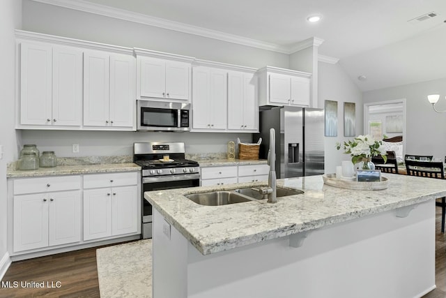 kitchen featuring a sink, stainless steel appliances, a center island with sink, and white cabinetry