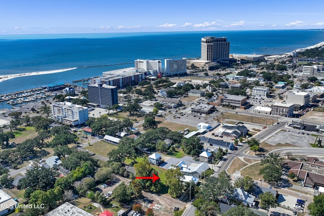 birds eye view of property with a water view