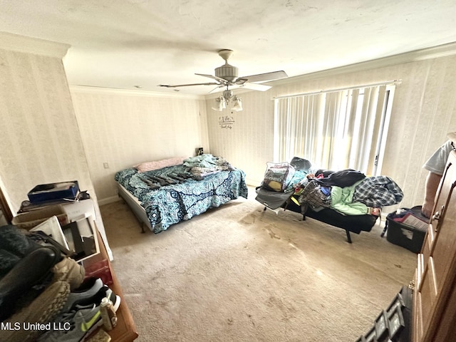 bedroom featuring ornamental molding, carpet, and ceiling fan