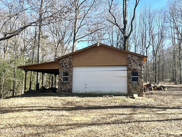 garage featuring a carport